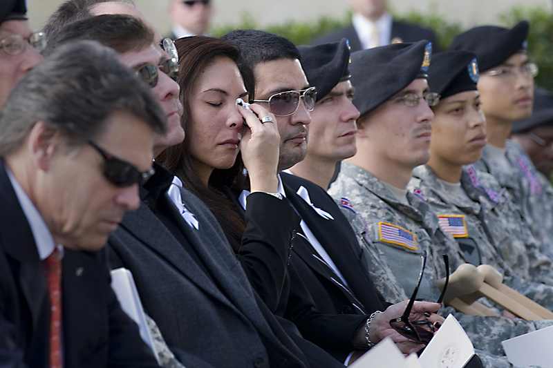 Families and soldiers at a memorial service after the Fort Hood shooting in 2009