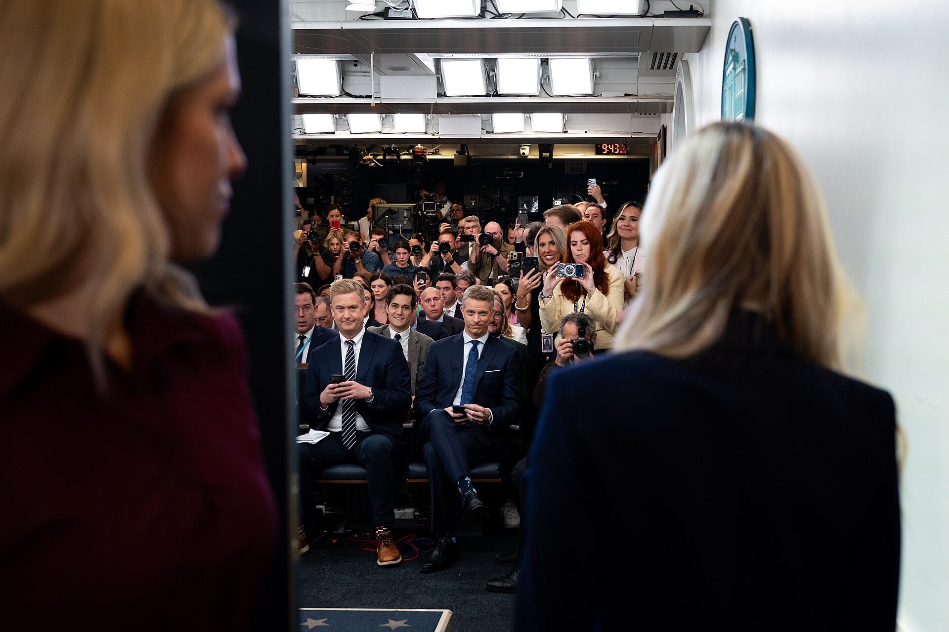 Katie Zacharia at the podium during her first and only White House press briefing on October 13, 2026, seen from behind the lectern facing the press corps