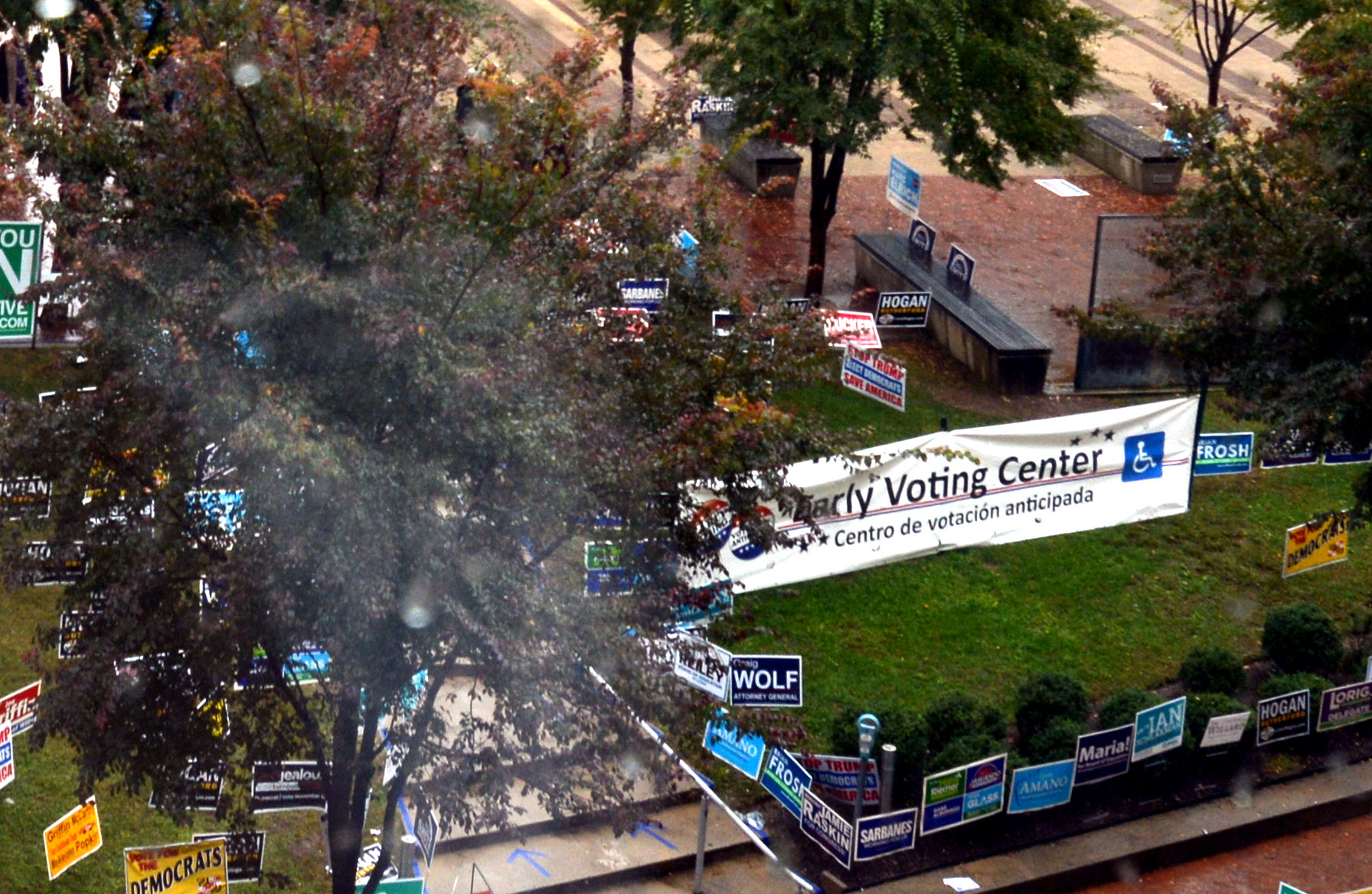 An early voting center banner and campaign signs at a U.S. early voting site — DOJ blocking state certification midterms