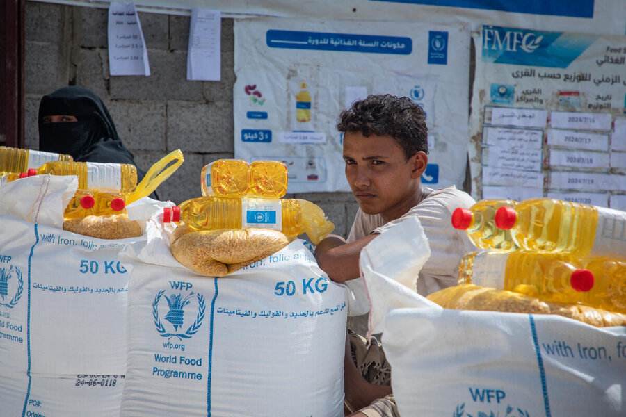 World Food Programme food baskets and cooking oil at a Yemen aid distribution as food insecurity deepens