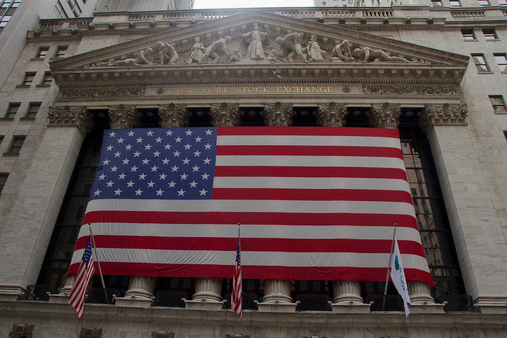 The Broad Street facade of the New York Stock Exchange in New York, draped with a giant American flag — file photo for stock market today October 26 2026