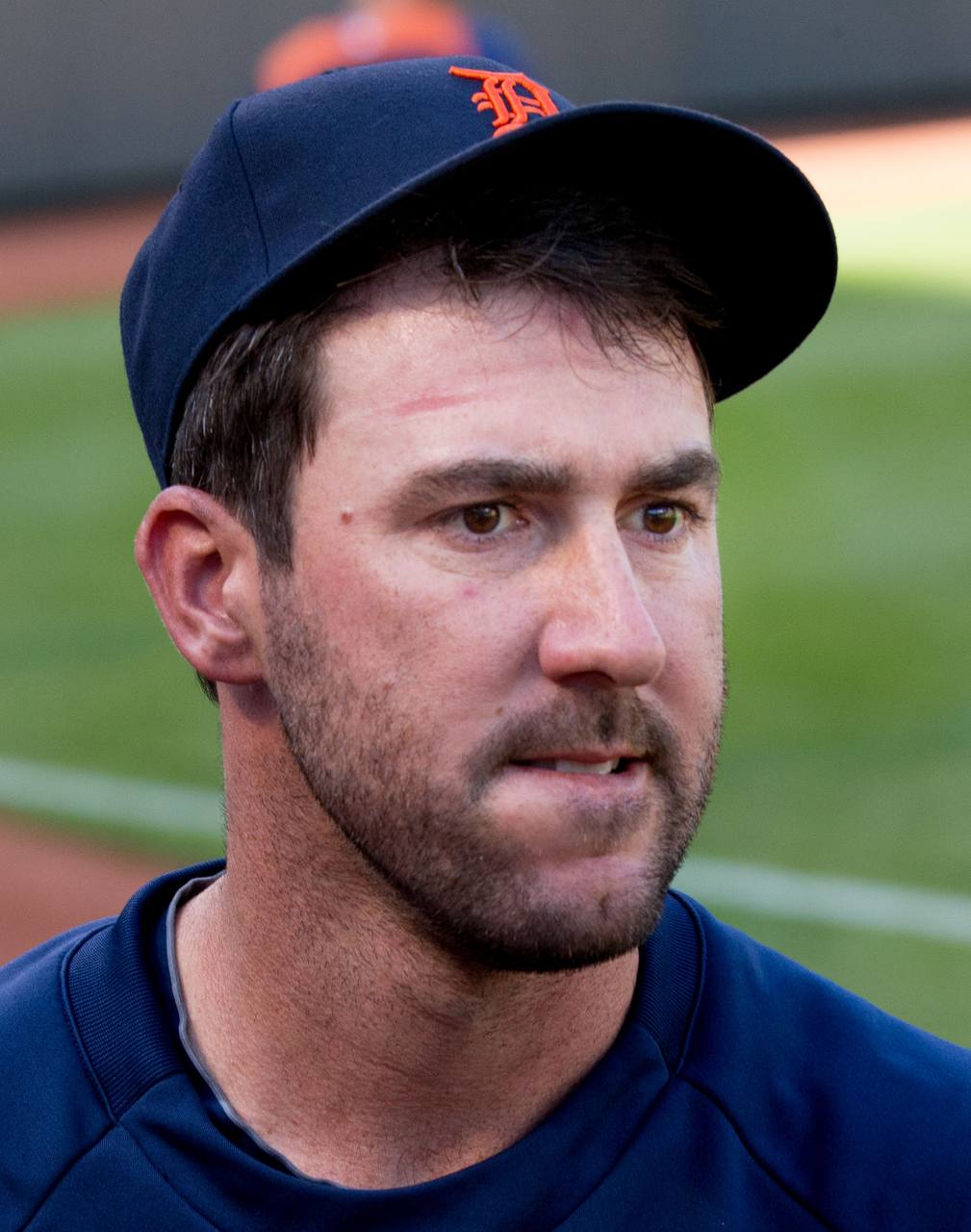 Justin Verlander pitching for the Detroit Tigers — the three-time Cy Young winner retired Saturday after 21 major-league seasons