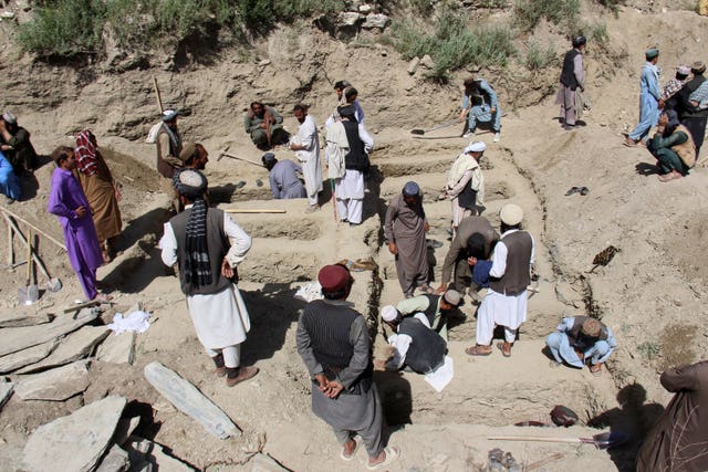Residents digging graves after earlier Pakistani strikes in eastern Afghanistan