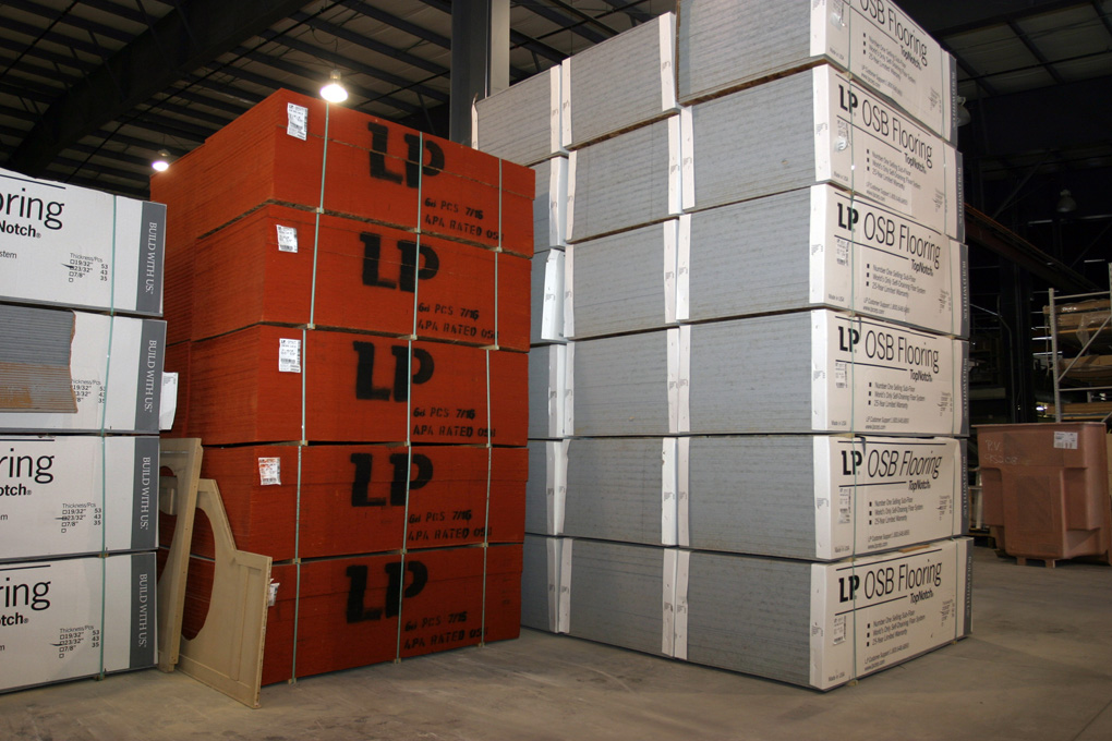 Building materials stacked for manufactured home production — Trump executive order creates Task Force on Manufactured Housing Innovation