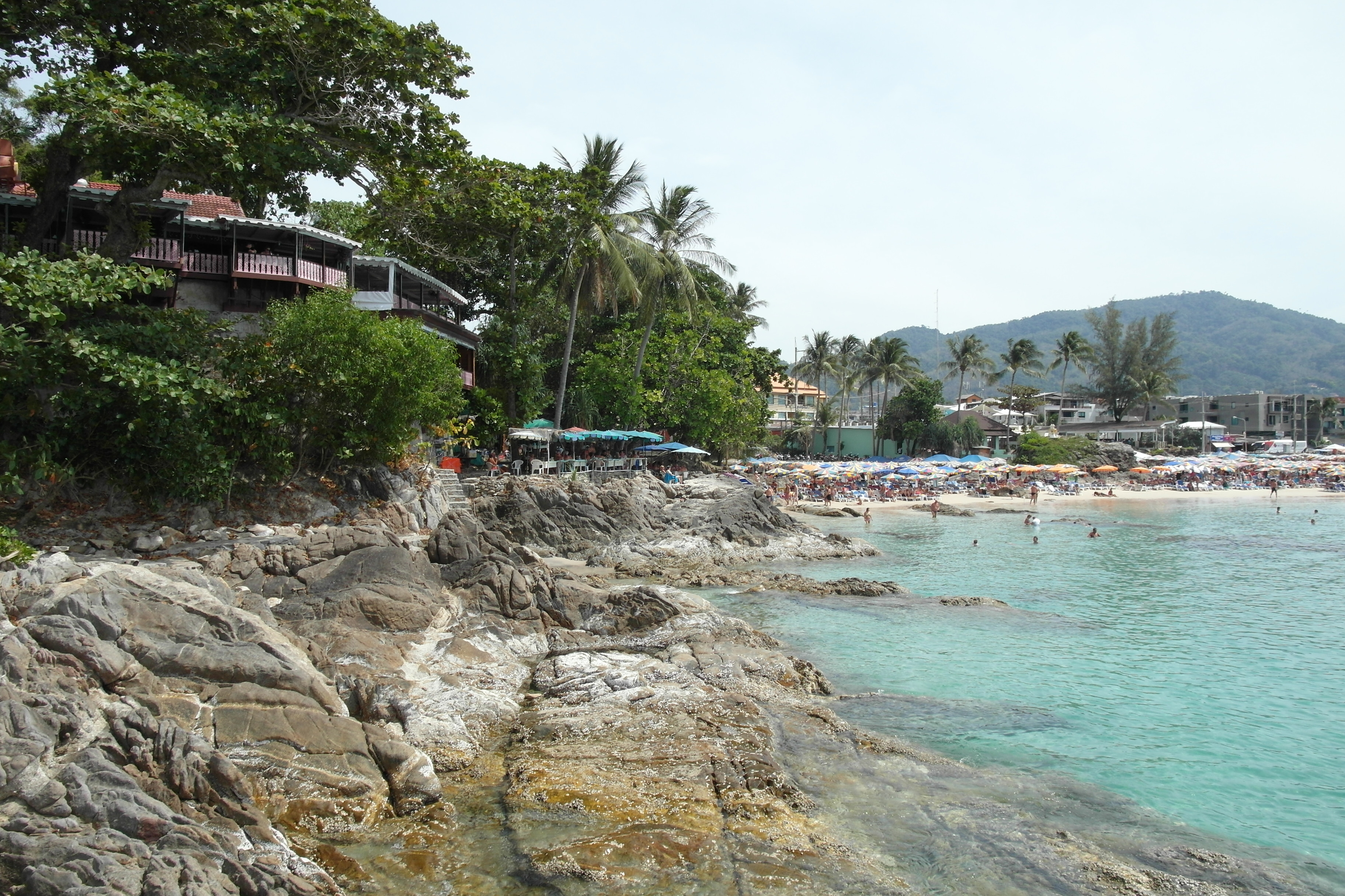 Patong beach in Phuket, Thailand, backed by the green hills that shed torrents of mud and water into the resort town during the Phuket flash floods
