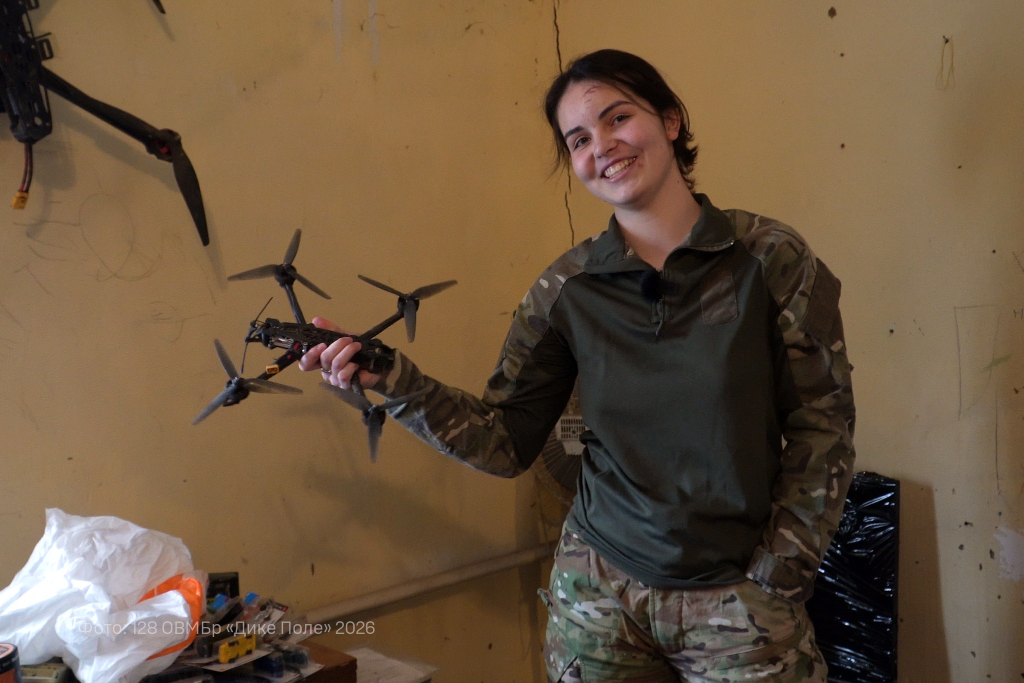 Ukrainian FPV drone operator Miroslava of the 128th Heavy Mechanized Brigade holding a first-person-view drone — Russian casualties October record coverage