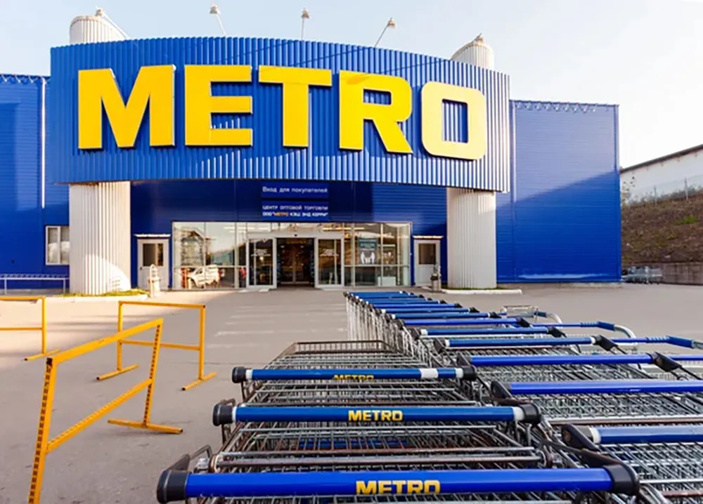 A Metro wholesale store with Russian-language signs and shopping carts outside