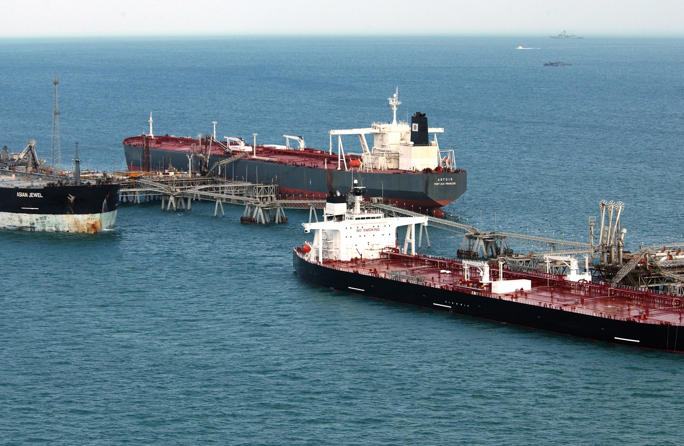 Two supertankers loading crude at an offshore terminal in the northern Persian Gulf, in a file photograph illustrating the Iran seven tankers hit Hormuz claim — no photograph of any of the seven vessels Tehran described has been released, and Iran named none of them