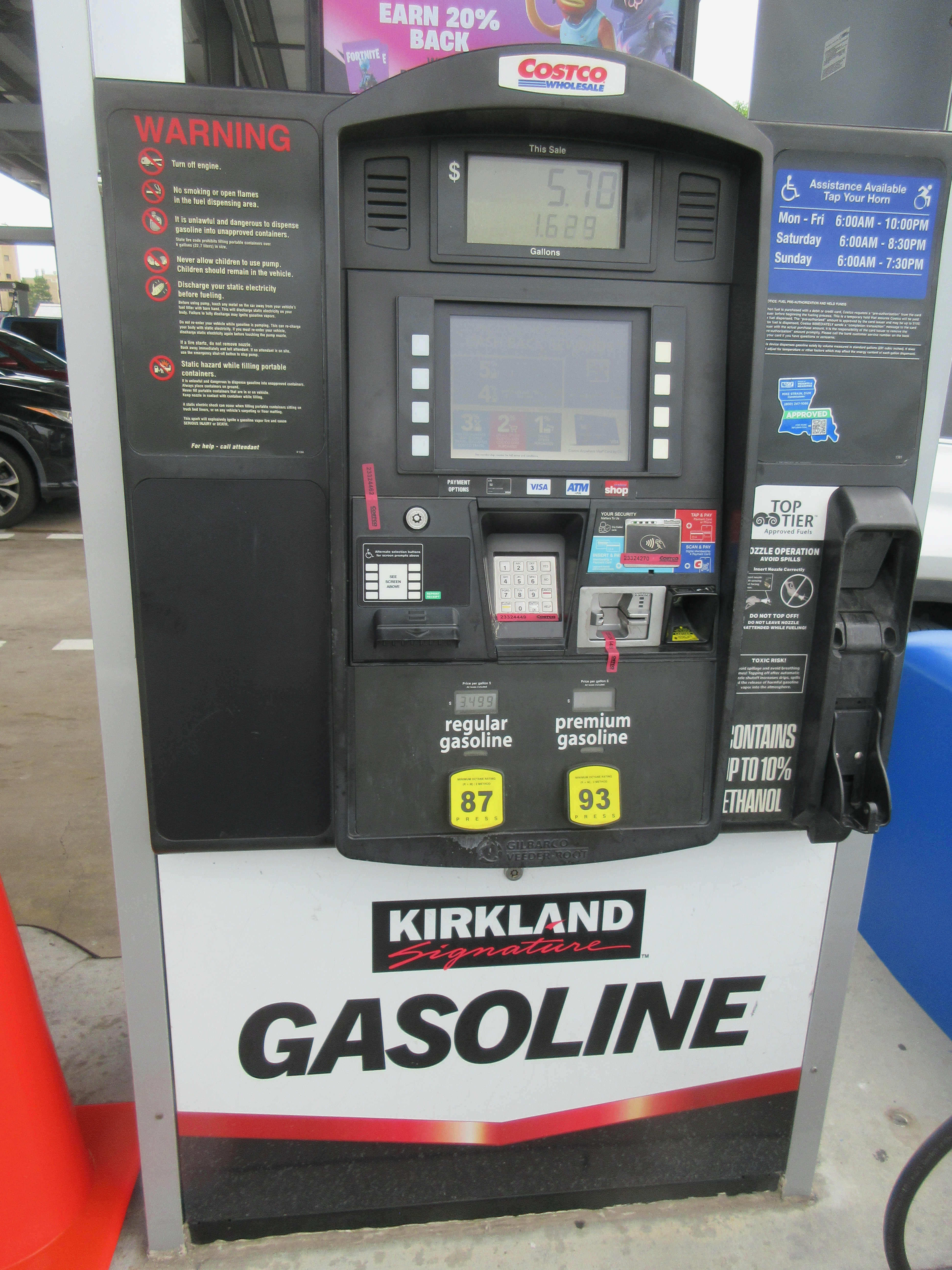 A driver fuelling at a Costco gas pump in New Orleans — file photo for US gasoline and diesel prices October 2026