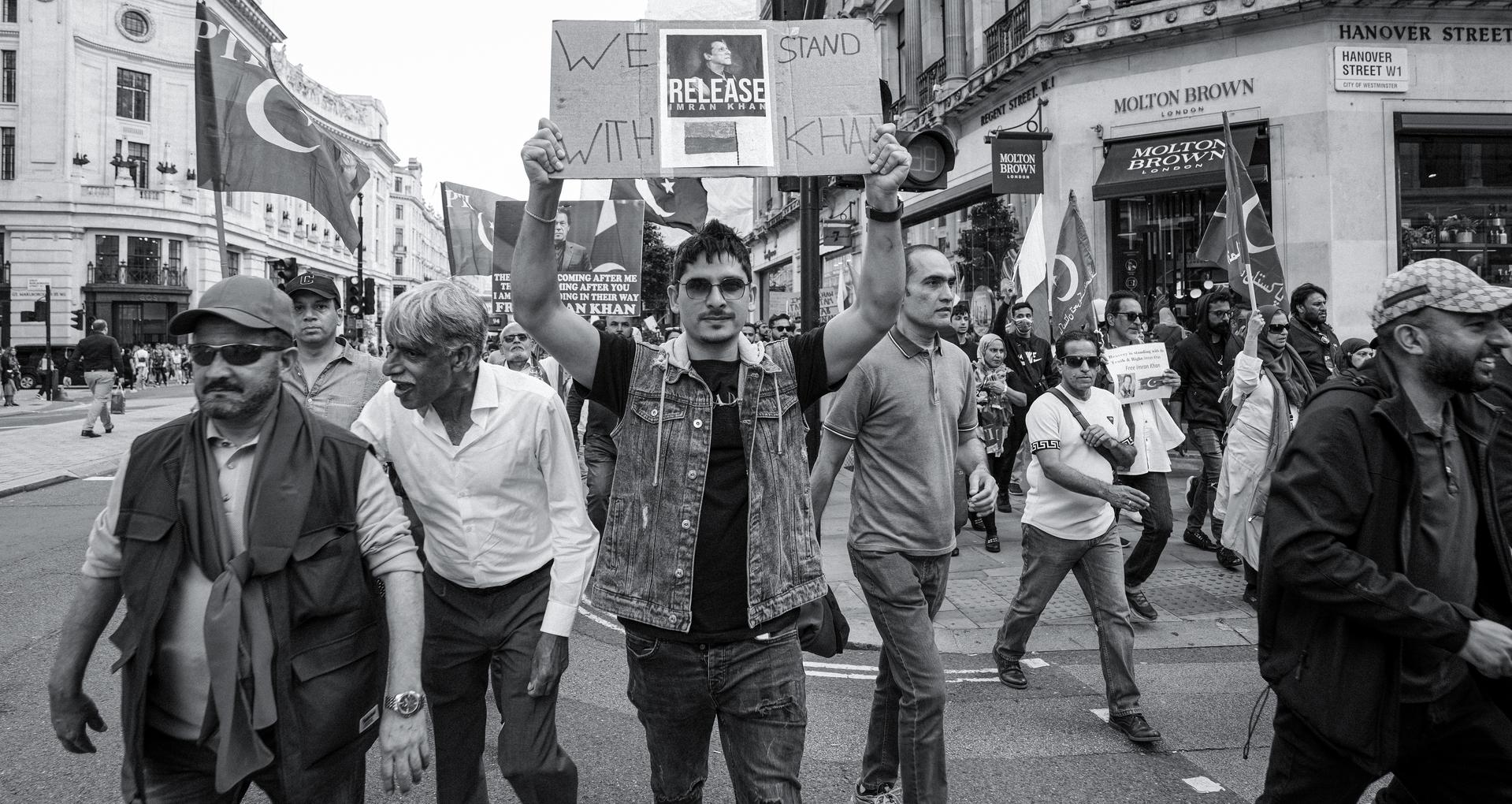 Supporters march through central London demanding the release of jailed former Pakistani prime minister Imran Khan, one holding a placard reading Release Imran Khan