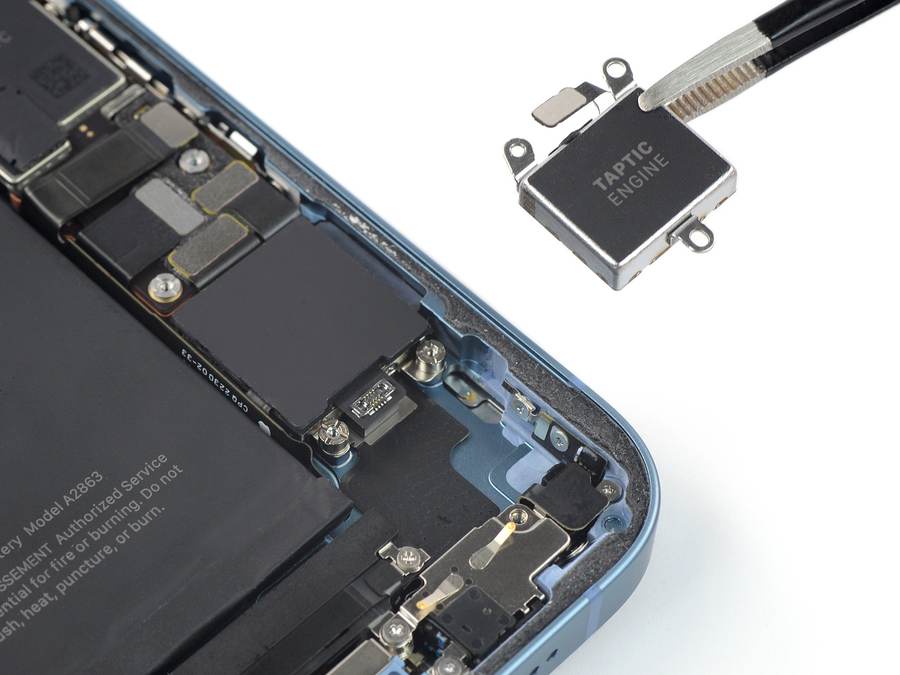 The Taptic Engine component held by tweezers beside an opened iPhone — the haptic hardware behind the Apple $5.7 billion patent verdict won by Taction Technology