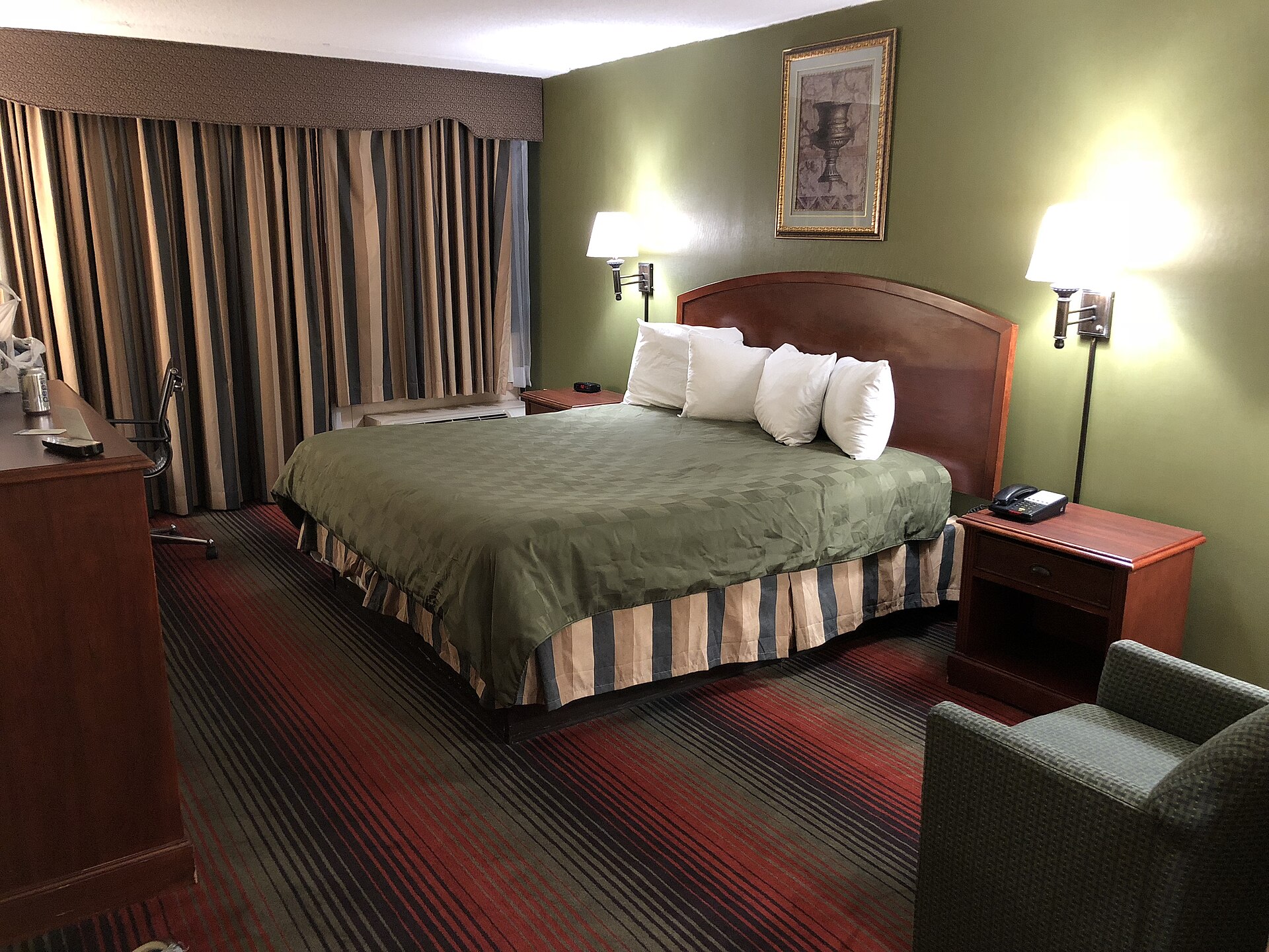 A made hotel bedroom bed, the kind of bed guests will no longer have to strip under the Airbnb checkout chores ban