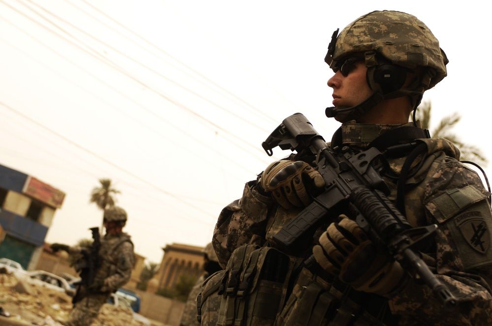 US soldiers on patrol in Baghdad — the US-led coalition has handed over all its military bases and command posts to Iraqi authorities