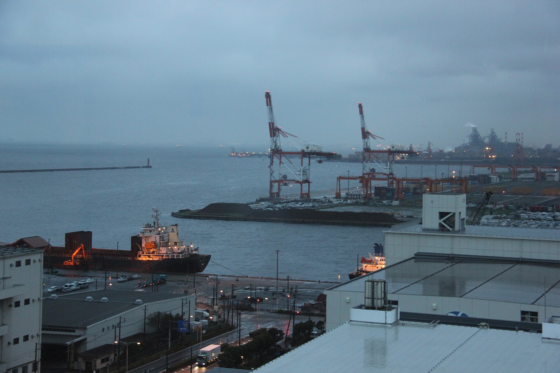 Japan PMI October 2026 — the Keihin industrial waterfront at dusk, as Japan's manufacturing growth slows to a seven-month low
