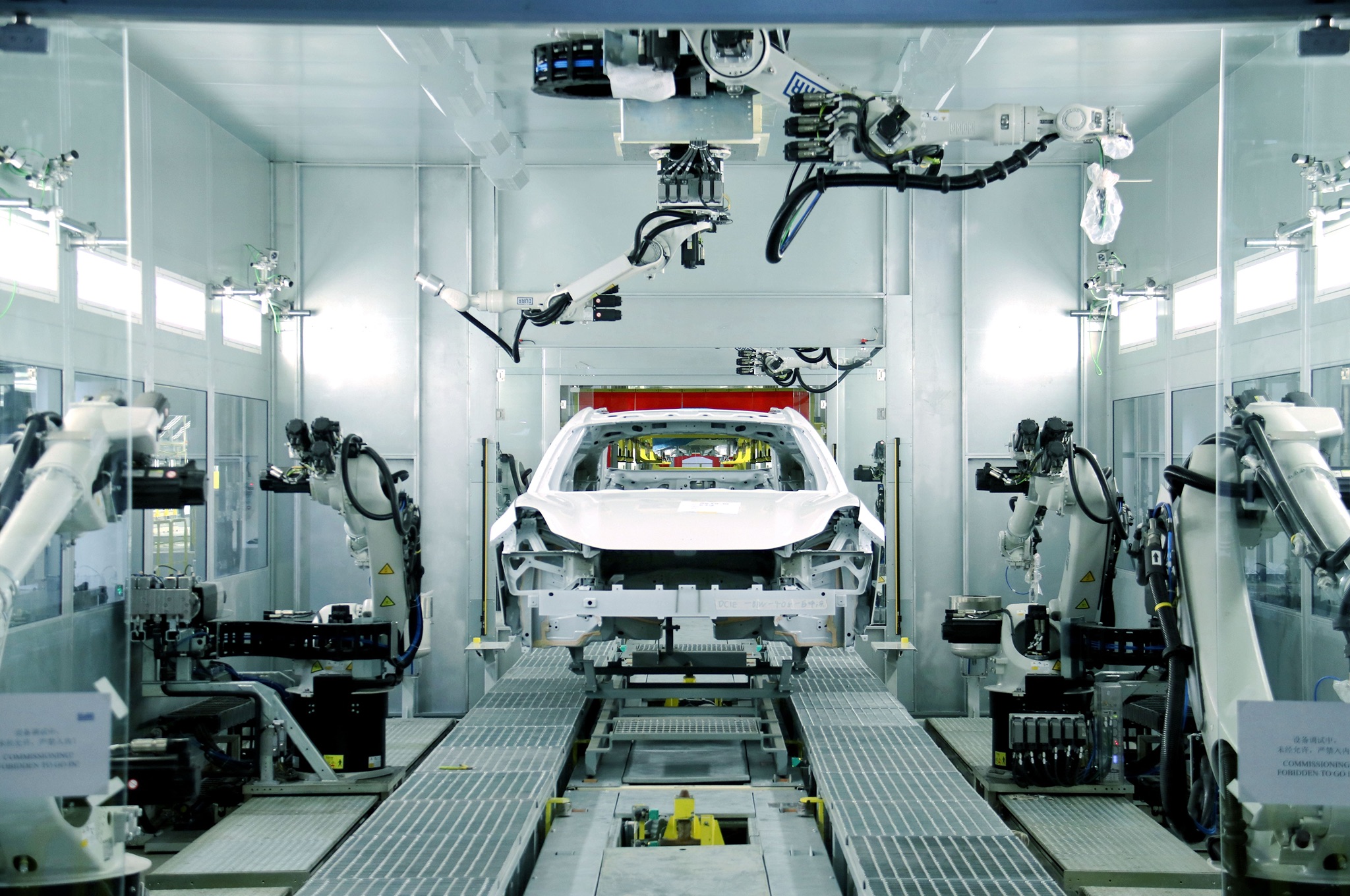 Robots in the paint workshop of Zeekr's factory in Hangzhou, China — new energy vehicle production rose 16.9 percent in September even as total vehicle output fell, file photo
