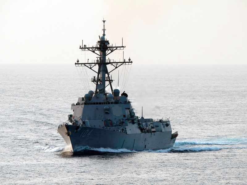 The guided-missile destroyer USS Sterett transits the Strait of Hormuz — the kind of U.S. Navy escort now shadowing commercial tankers through the October 2026 Hormuz tanker attack wave