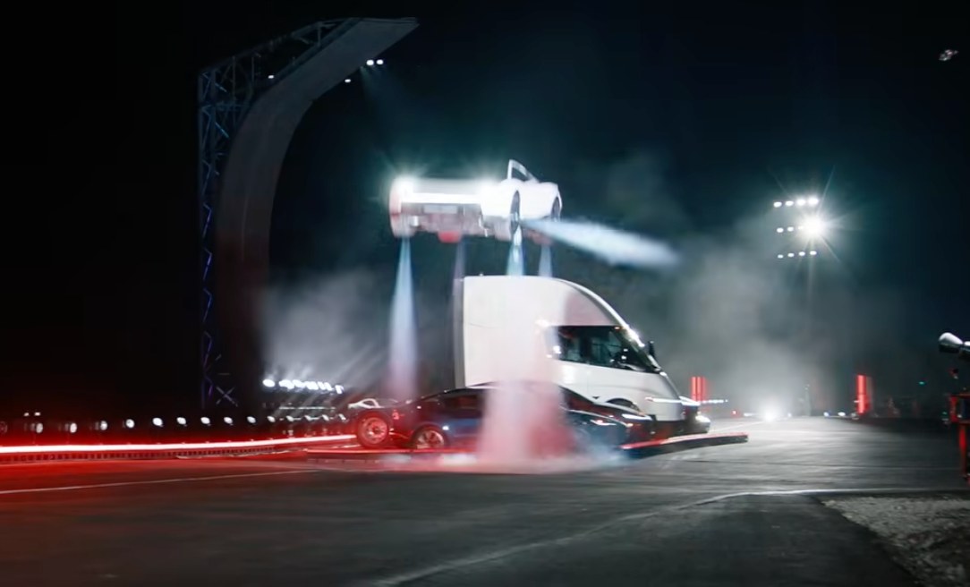 The Tesla Roadster airborne on thruster plumes above a Tesla Semi during the McGregor demonstration