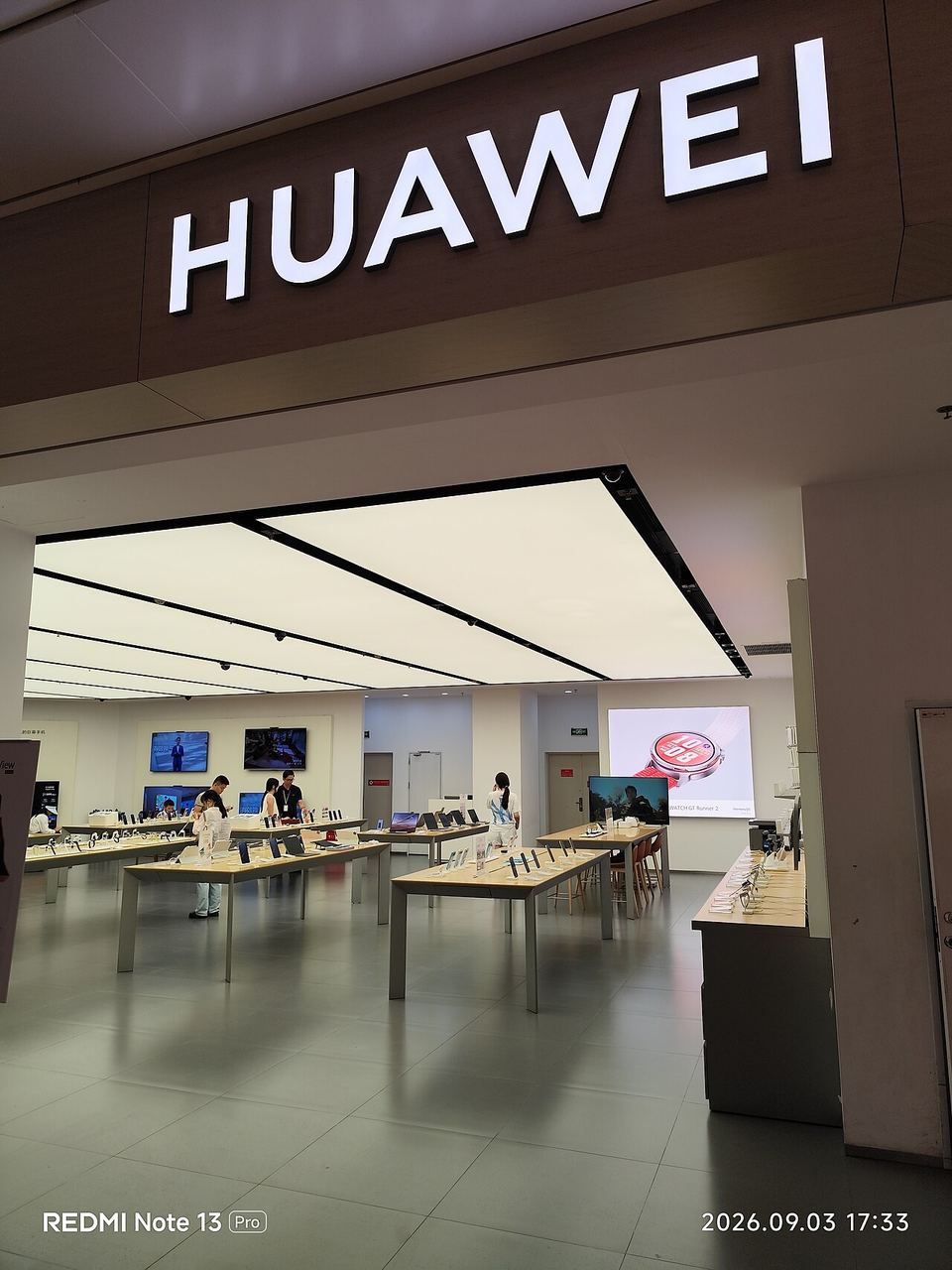 A Huawei retail store in Shenzhen, China, photographed in September 2026 — Huawei announced its Ascend 960DT AI chip will launch in Q1 2027, nine months early, at Huawei Connect 2026