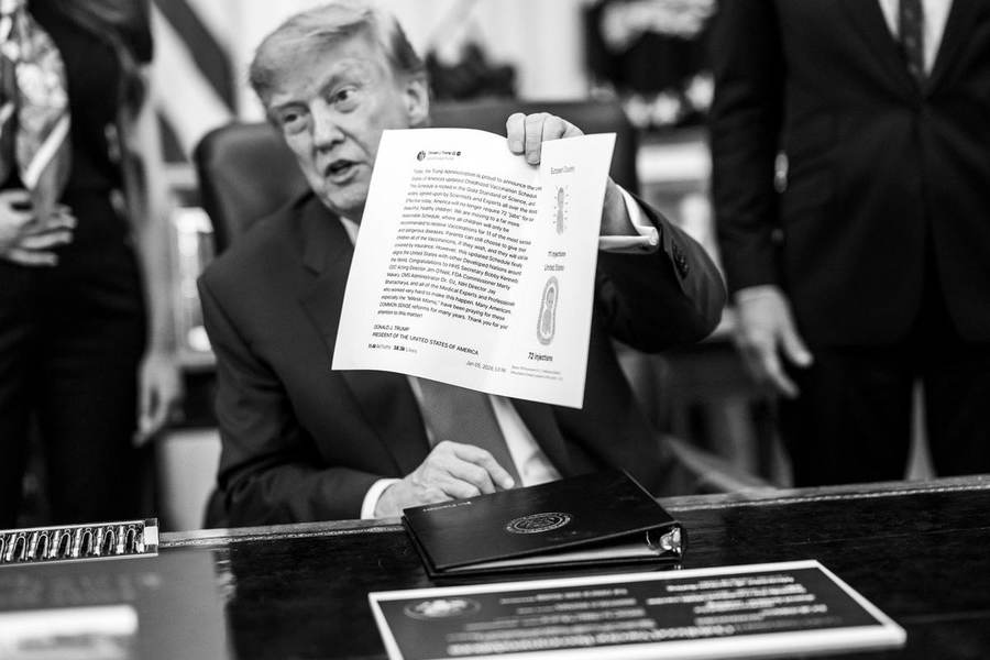 President Donald Trump signing an executive order in the Oval Office