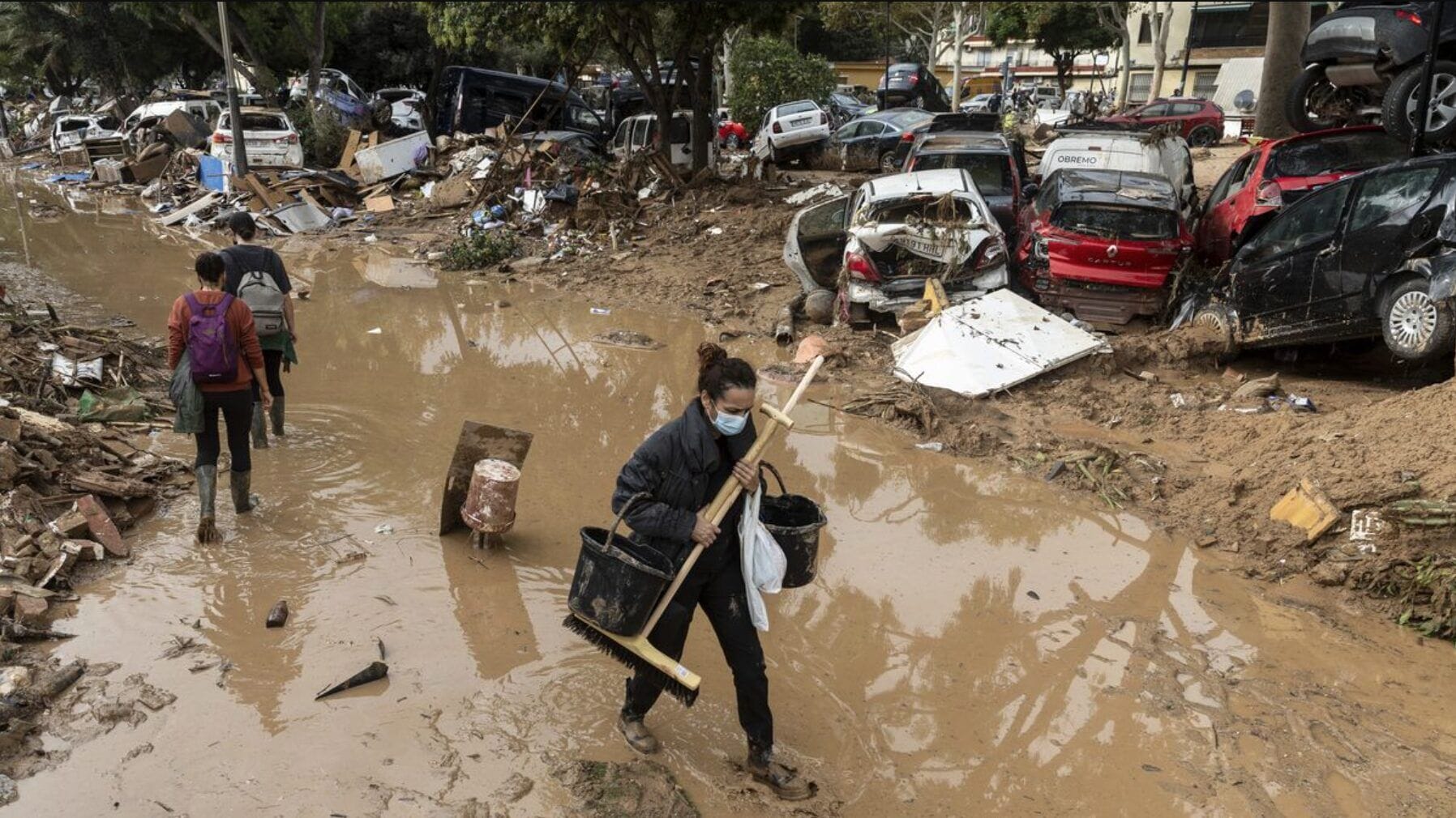 Barcelona street flooding and piled cars in a November 2024 context photograph
