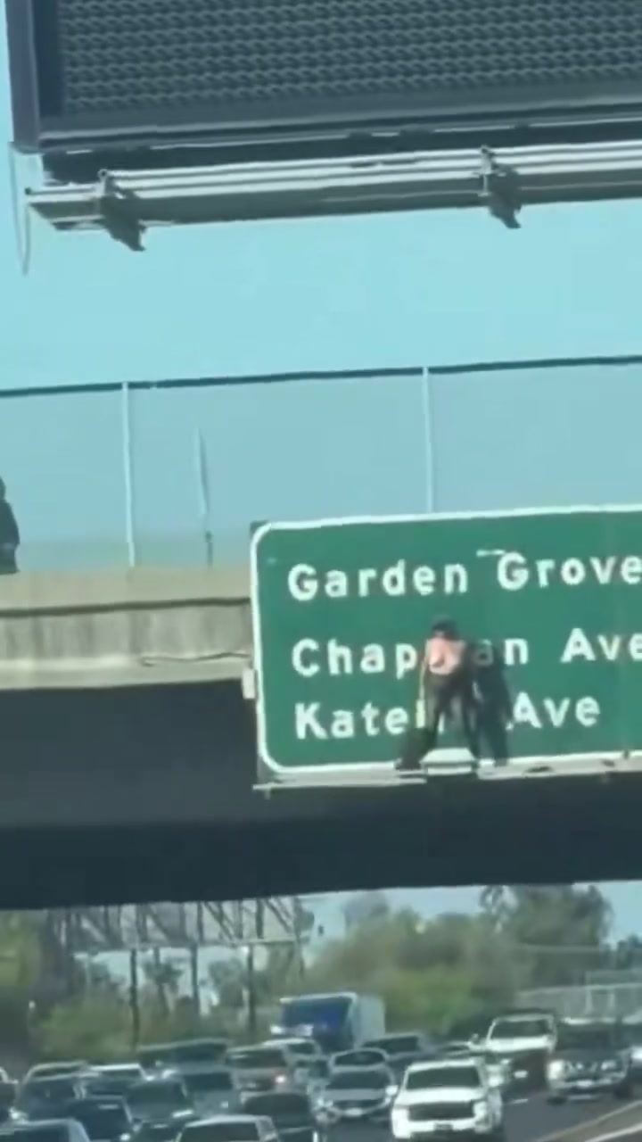 Traffic backed up on the 55 Freeway beneath the overhead sign during the Monday afternoon shutdown in Santa Ana