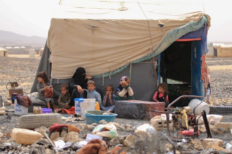 A displaced Yemeni family and children outside a shelter in Marib amid Yemen's displacement crisis