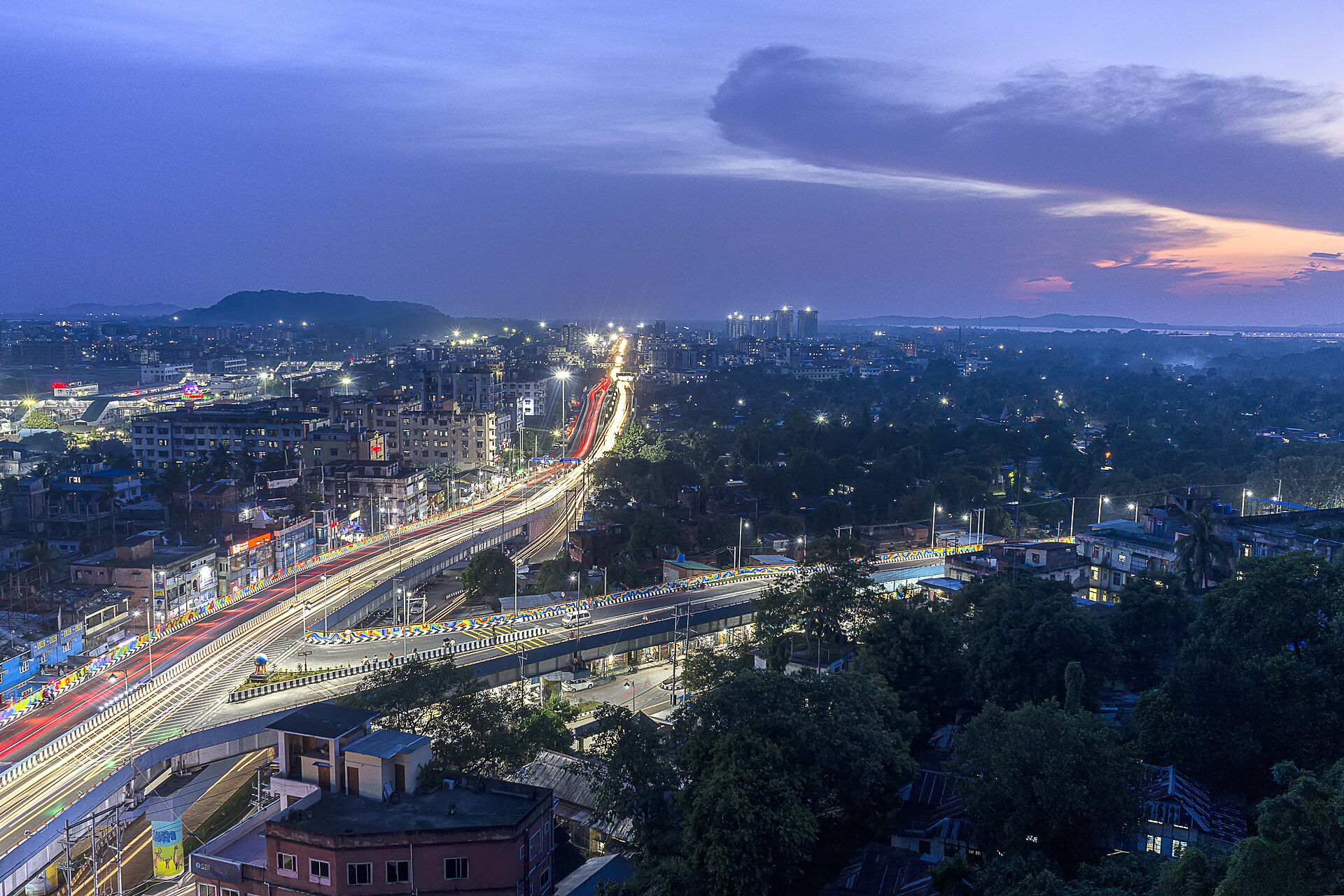 Guwahati at dusk in a file photo, the Nilachal flyover lit above the city in Assam, northeast India