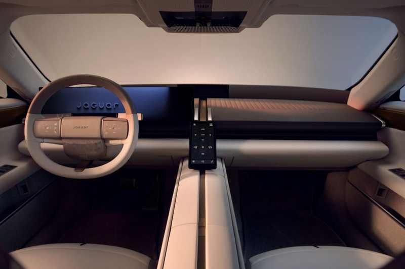 Minimalist Jaguar Type 01 electric GT cabin with steering wheel and central control screen
