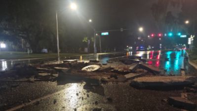 Broken pavement and a closed downtown Tallahassee street during the electrical fire response
