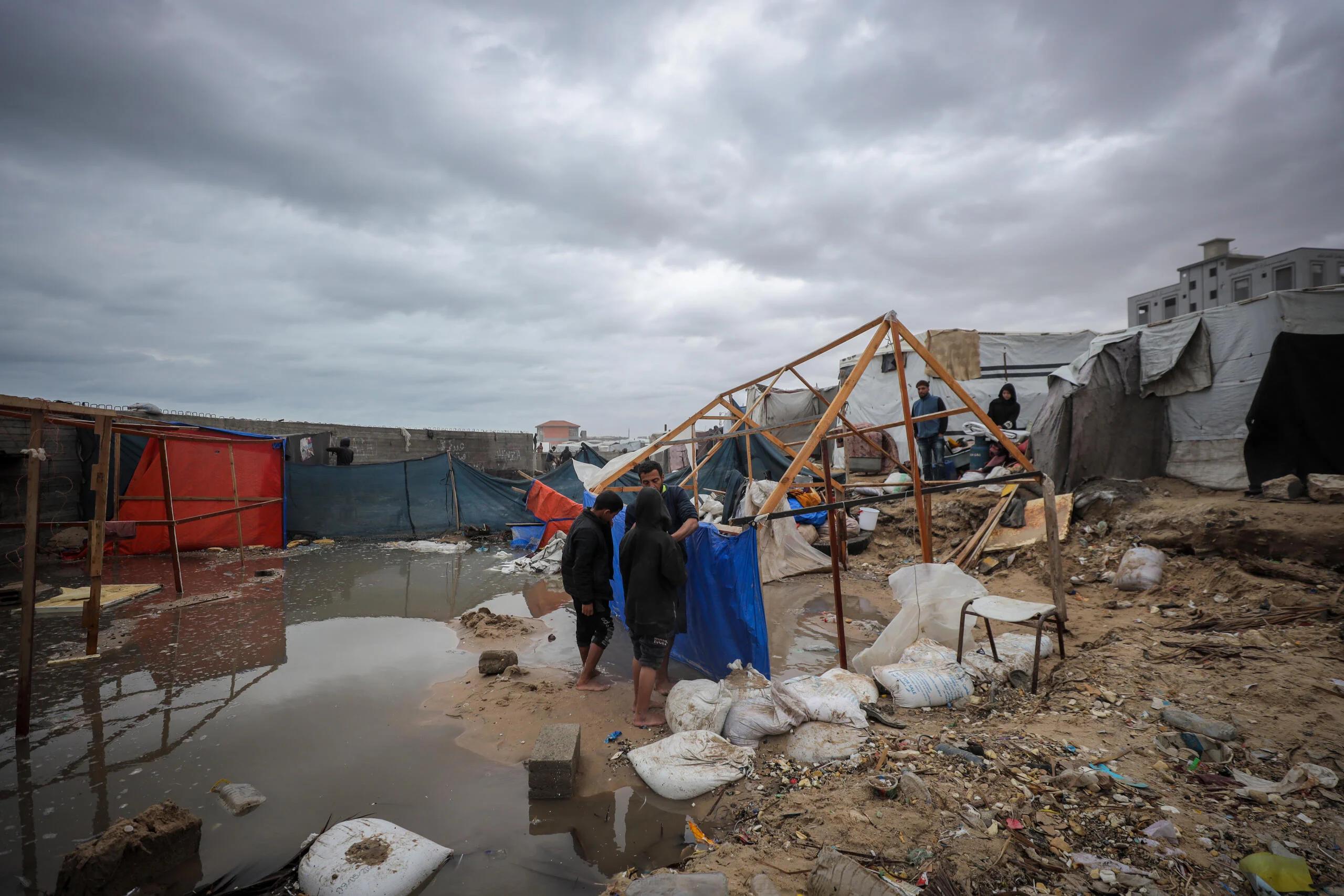Displaced Palestinians sheltering in tents in Gaza during the stalled ceasefire process