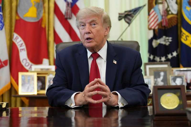 President Donald Trump before announcing a pre-midterm pause in new Iran attacks