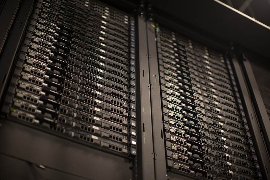 Server racks representing the computing infrastructure behind autonomous AI agents and GPT-6.1 Astra safety testing