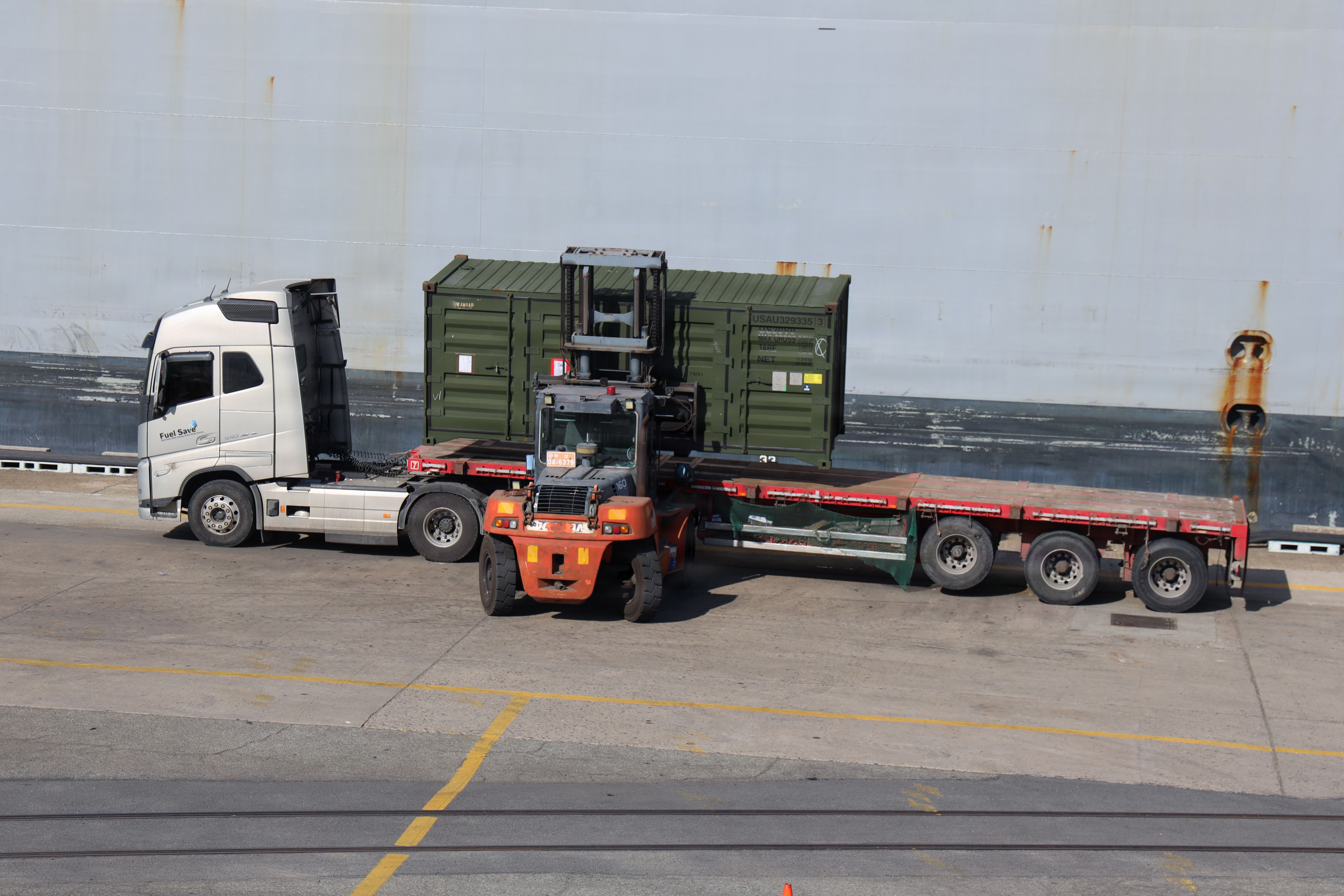 A container being moved at Pier 8 in Busan, South Korea, during port operations in 2026