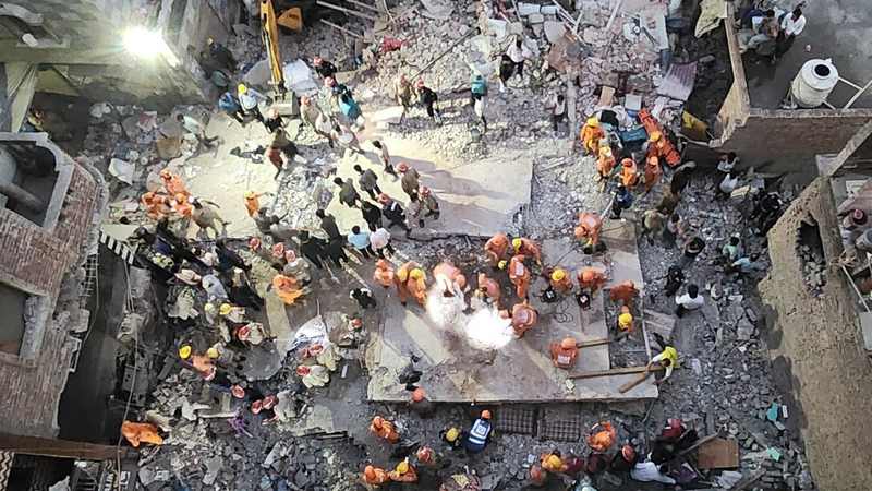 New Seemapuri building collapse rescue operation viewed above crowded Delhi street