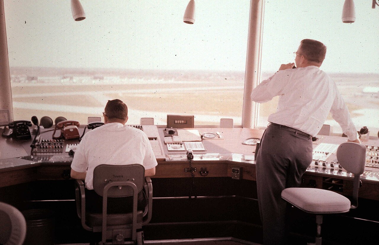 Historical photograph of civilian air traffic controllers in a Memphis tower cab, in the ASI air traffic AI story