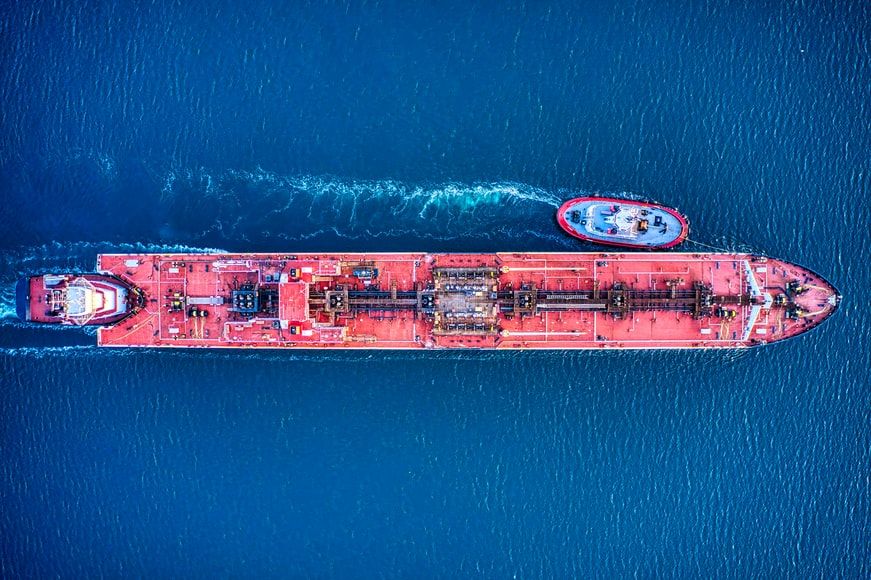 An aerial view of an oil products tanker at sea with a tug alongside — diesel cargoes are at the centre of the Trump Russia sanctions waiver dispute, file photo