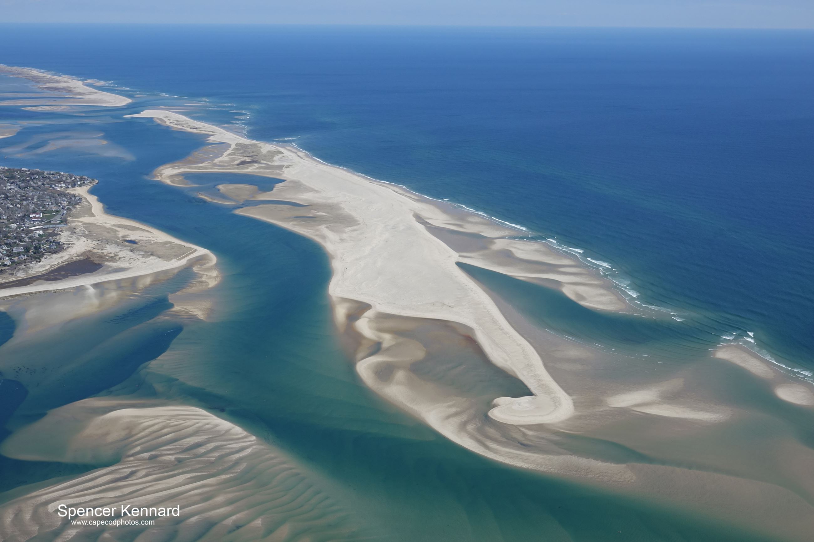 Aerial view of barrier beaches, channels and ocean off Chatham, Massachusetts