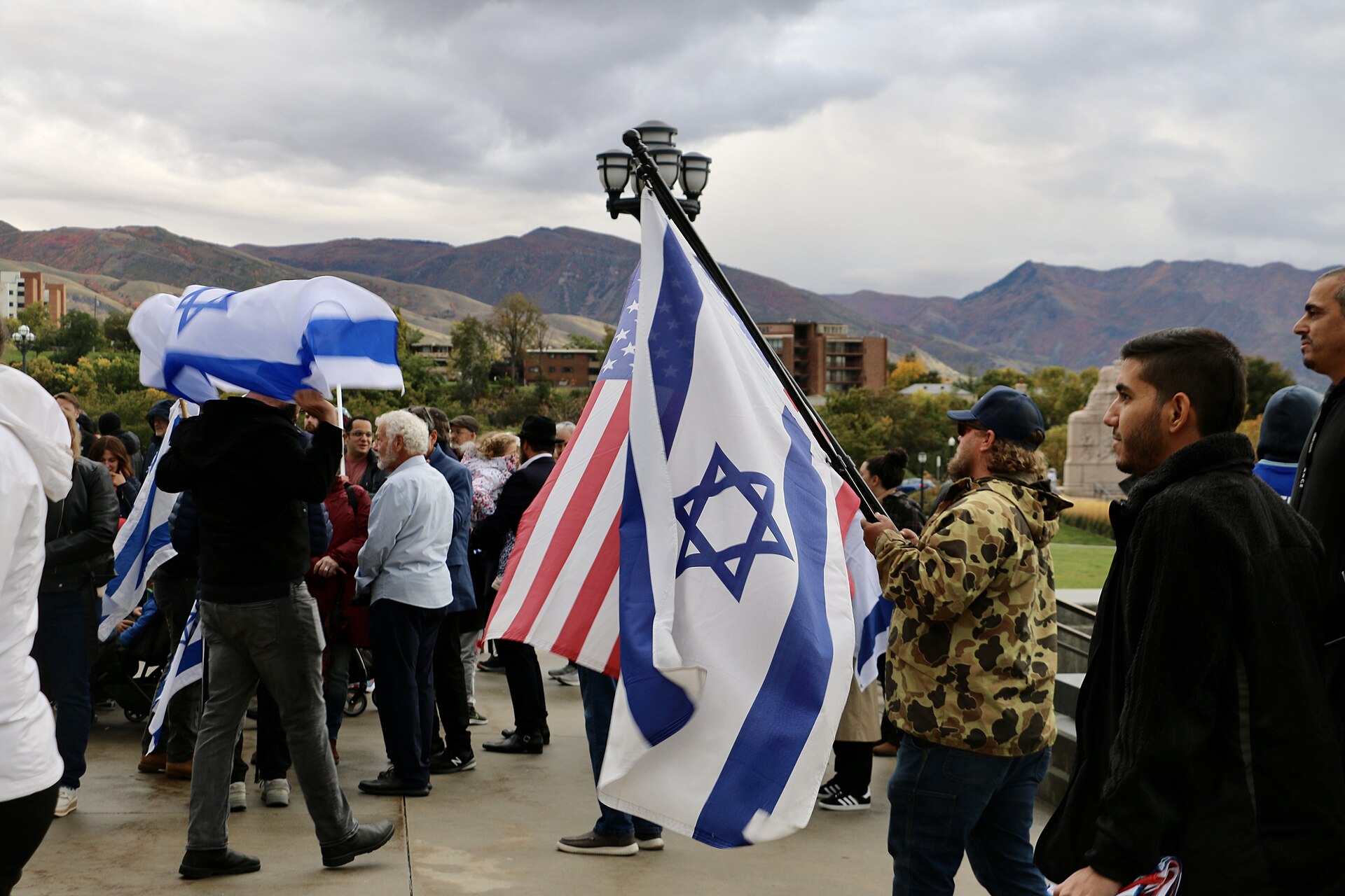 Supporters holding United States and Israel flags at a Stand With Israel event