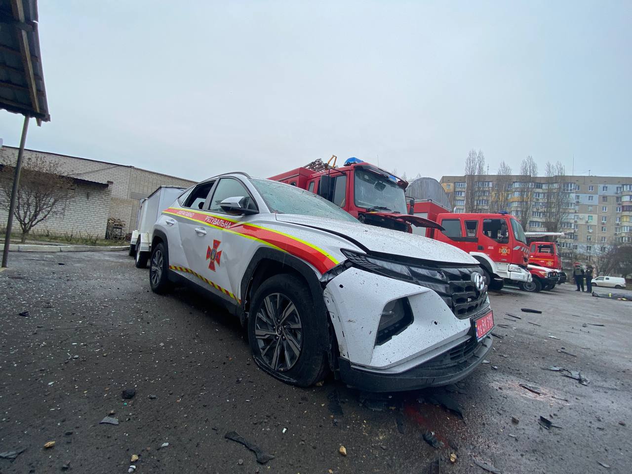 Damaged Ukrainian emergency service vehicles at a Kherson fire station hit by Russian shelling