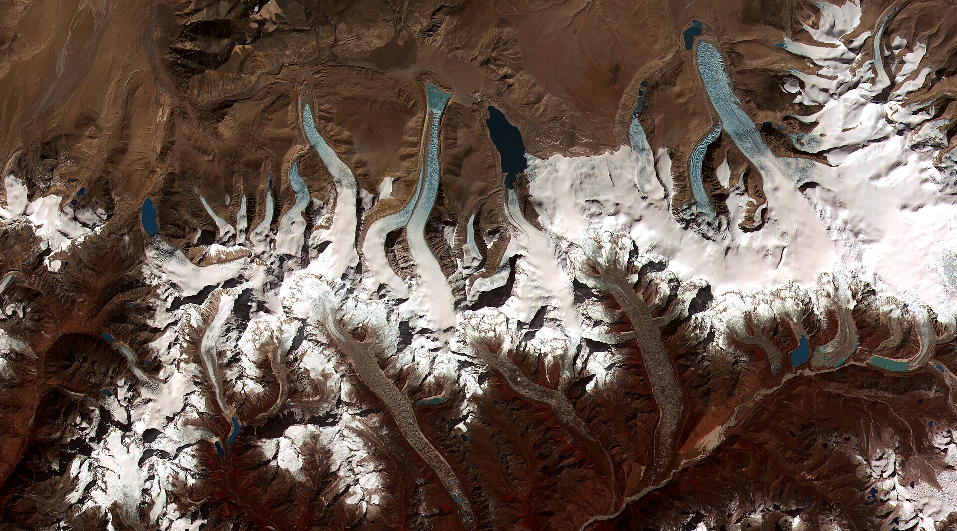 NASA ASTER satellite image of glacial lakes forming on debris-covered glaciers in the Bhutan Himalaya — the Bhutan glacial lake outburst flood risk seen from space