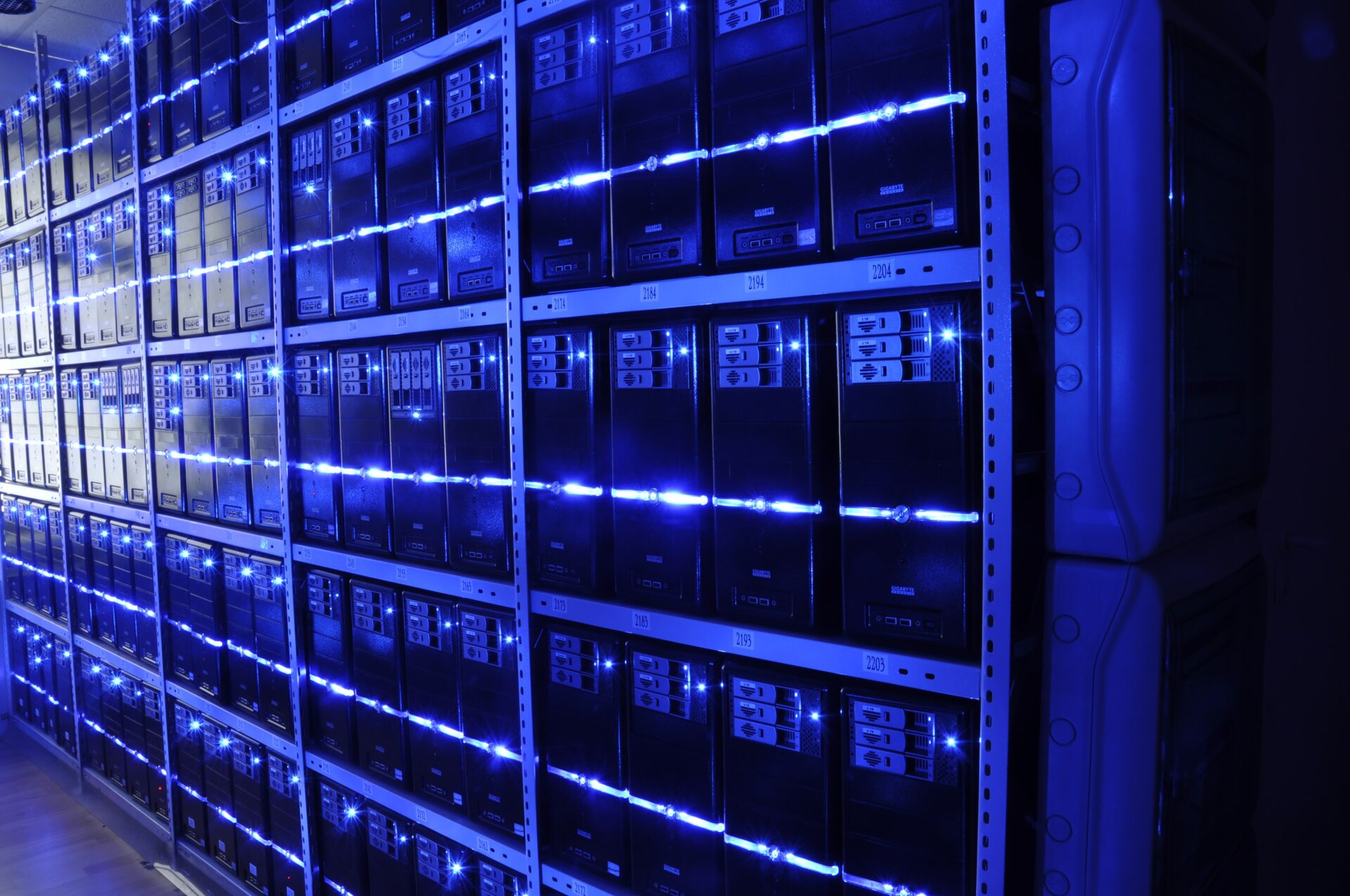 Rows of server racks and cabling inside a data center — file photo