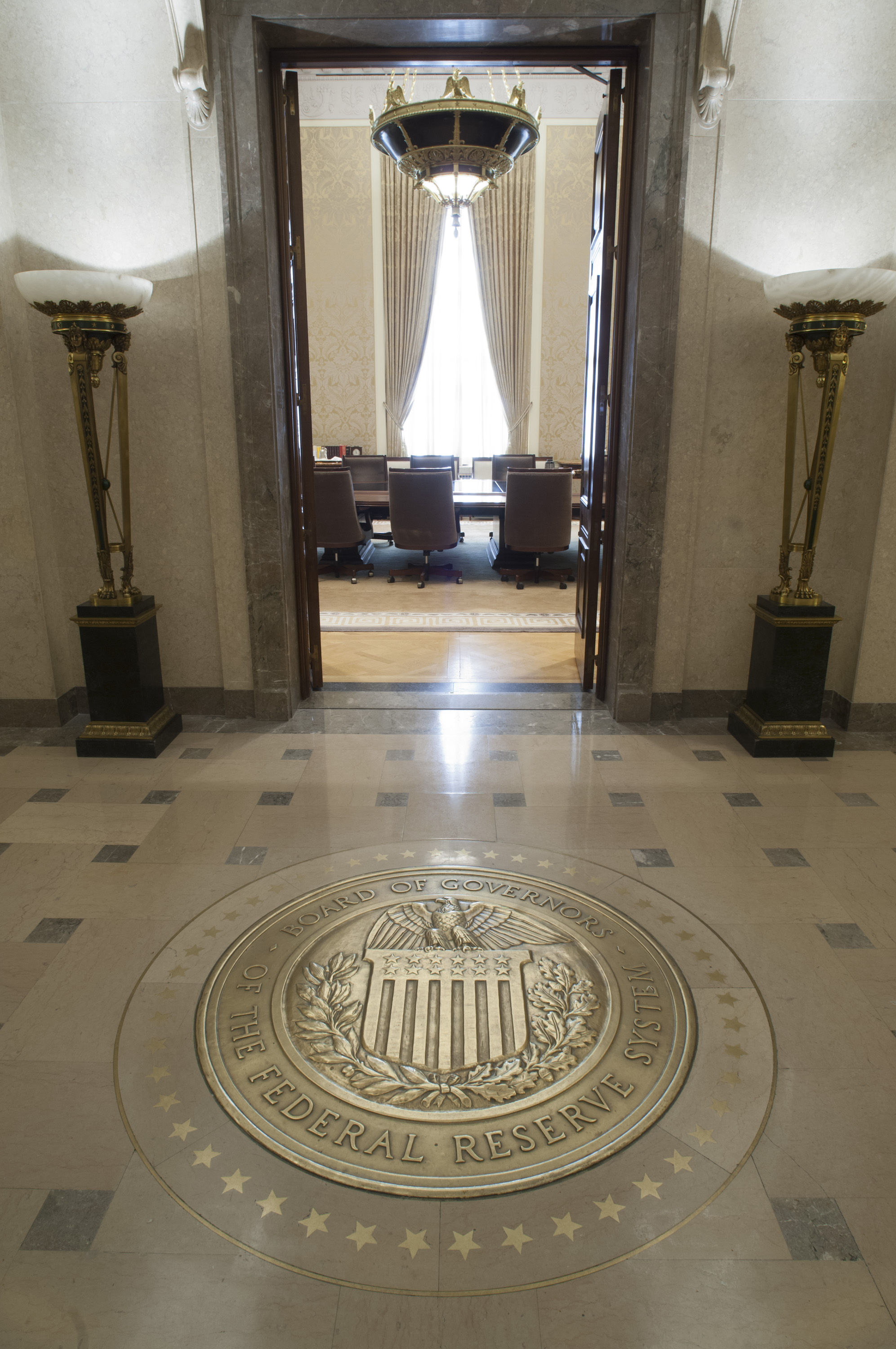 Entrance to the FOMC board room at the Federal Reserve in Washington, with the Board of Governors seal set into the floor — where the FOMC meeting October 2026 results were decided
