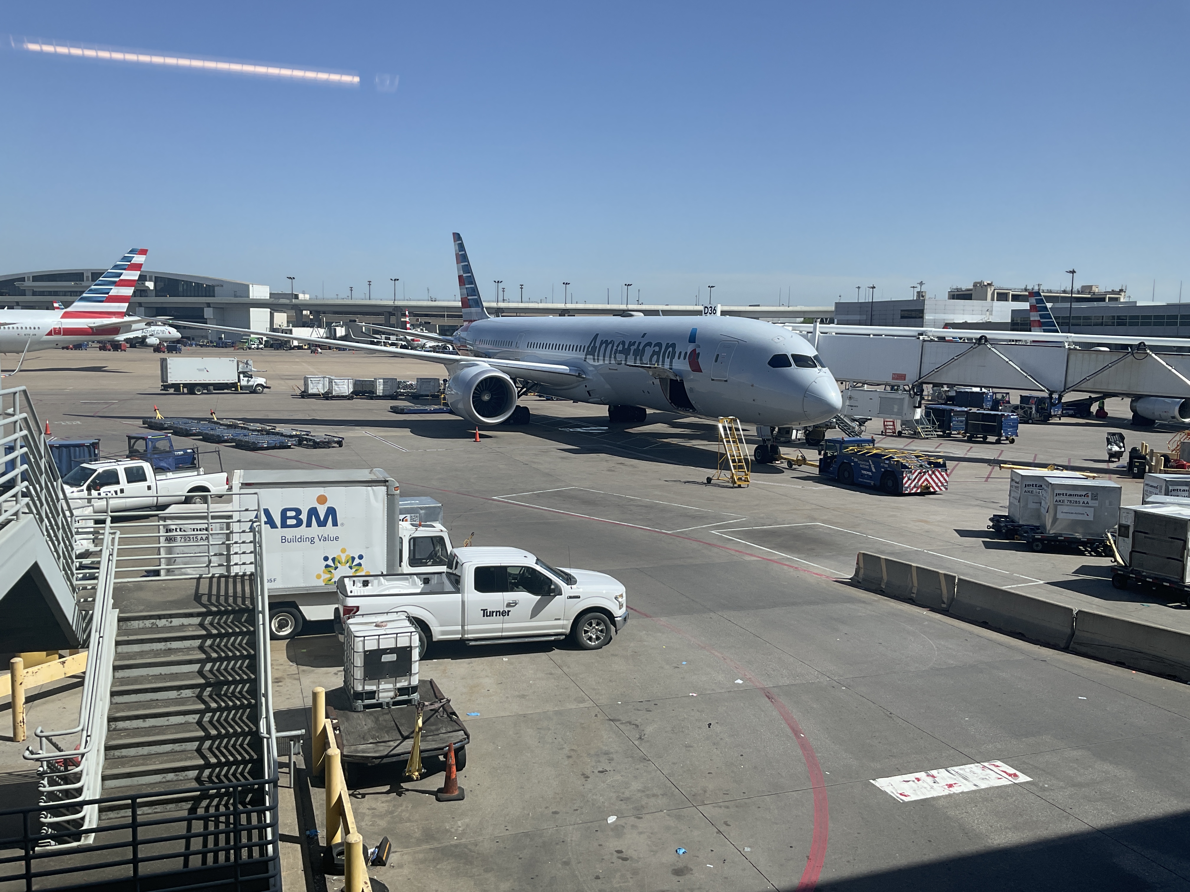 American Airlines Boeing 787 at a Dallas Fort Worth gate — American Airlines fuel costs 2026