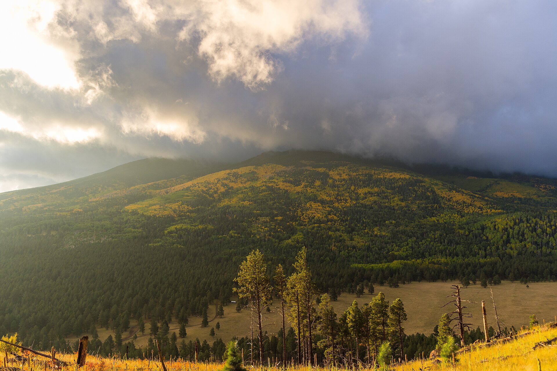 Arizona tornado watch today — storm clouds over the San Francisco Peaks above Flagstaff, in the corridor placed under a Level 3 severe storm risk on October 21