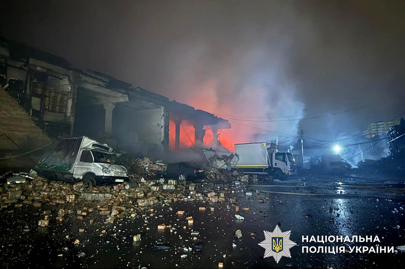 Burning agricultural warehouse and damaged vehicles after the September 24 strike on Stara Hnylytsia in Ukraine's Kharkiv region