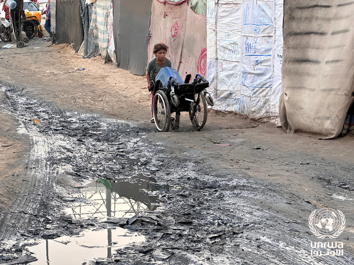 Sewage water pools beside the tents of displaced people in Deir el-Balah in the Gaza Strip, where camp sanitation has broken down