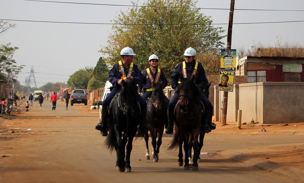 South African Police Service officers respond after the Johannesburg tavern shooting killed 17 people in Wedela township, September 2026