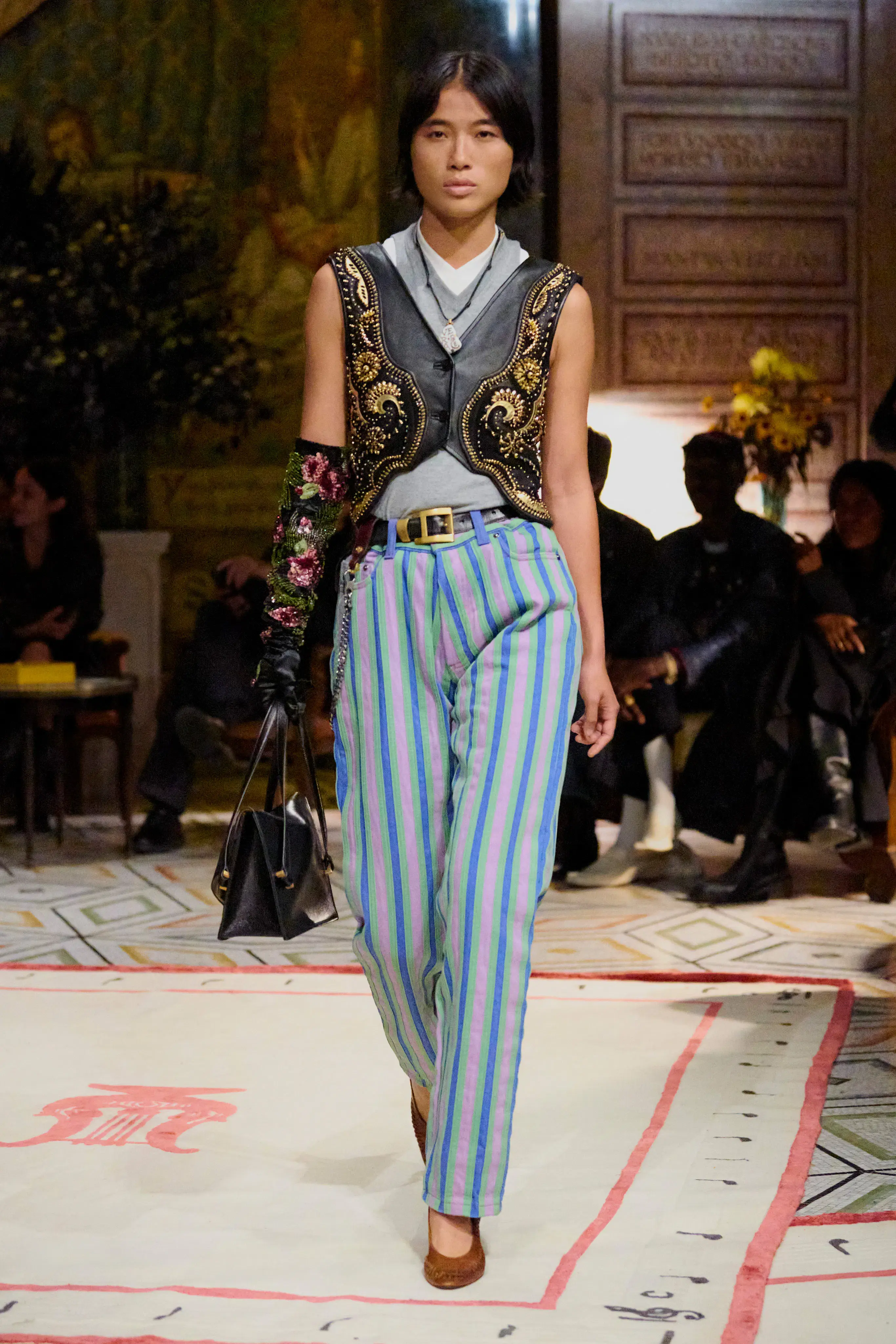 Model in a Versace runway look before Pieter Mulier's first collection