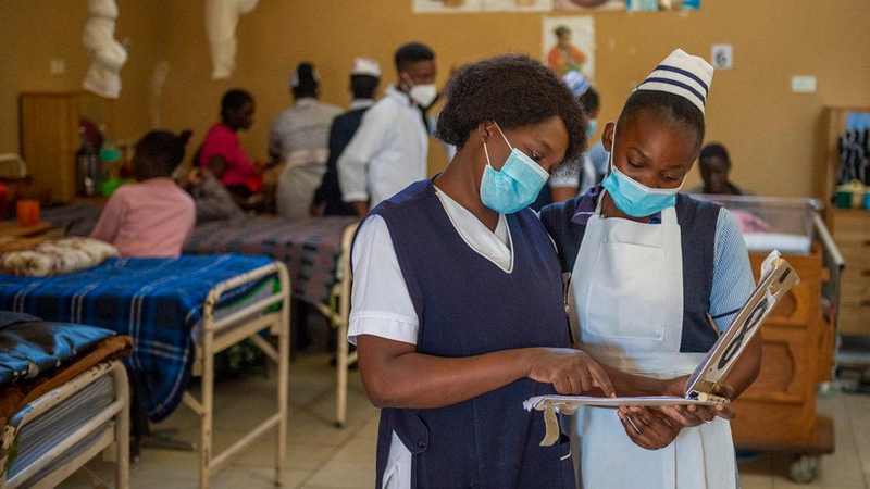 Health care workers at Mwandi Mission Hospital in Zambia; the new U.S.-Zambia pact will fund 40,000 new health worker recruitments