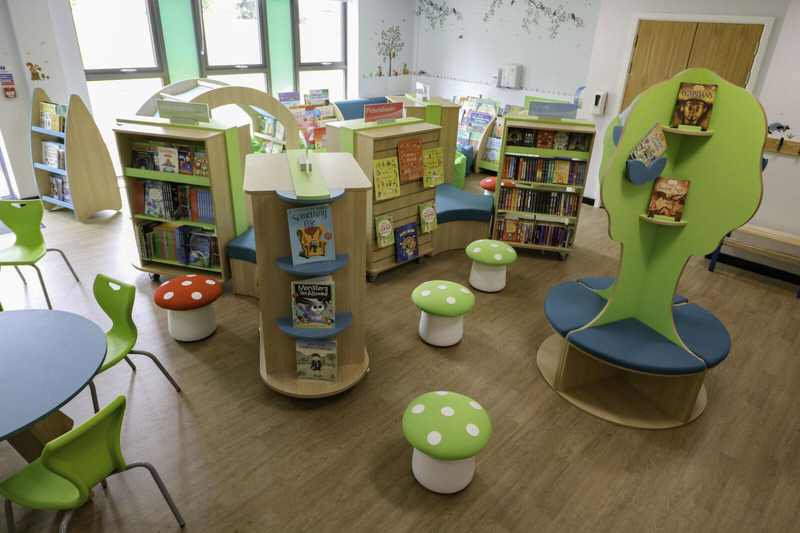 A school library reading room with bookshelves